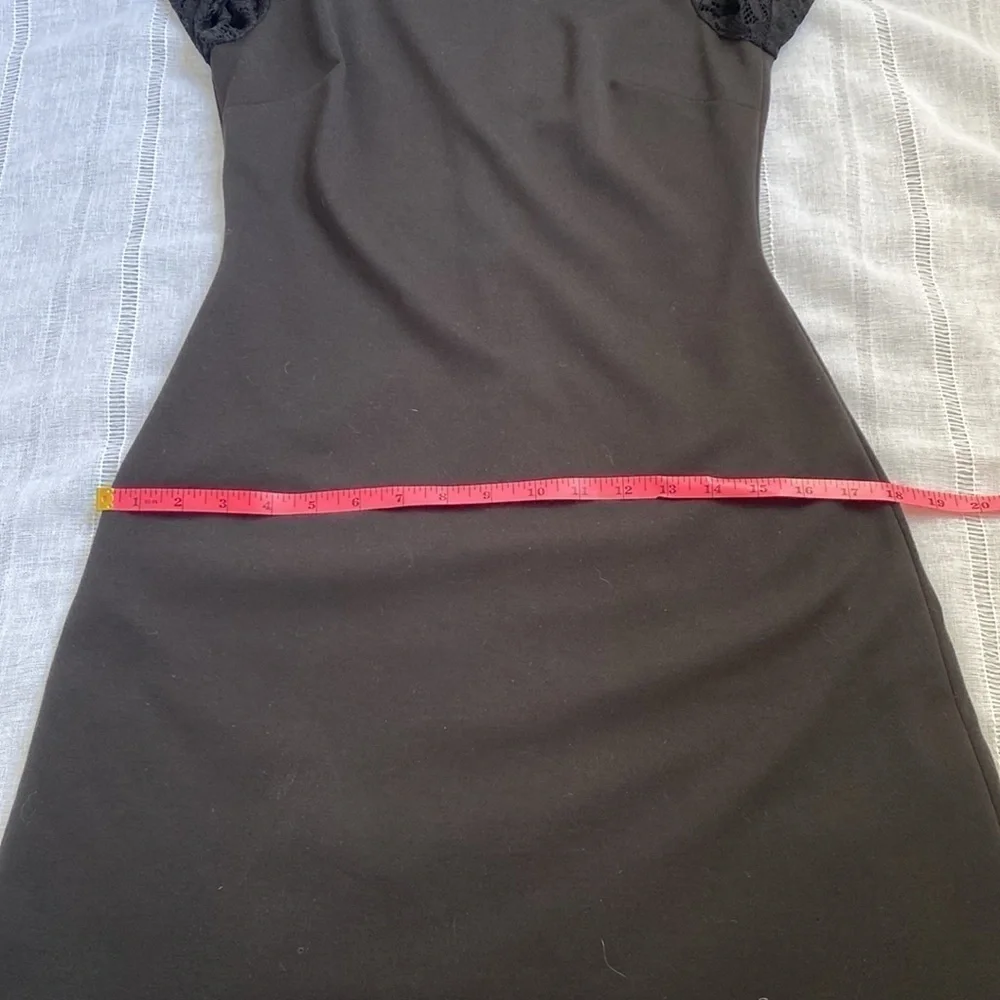 Tommy Hilfiger little black dress with long sleeves lace sleeves.